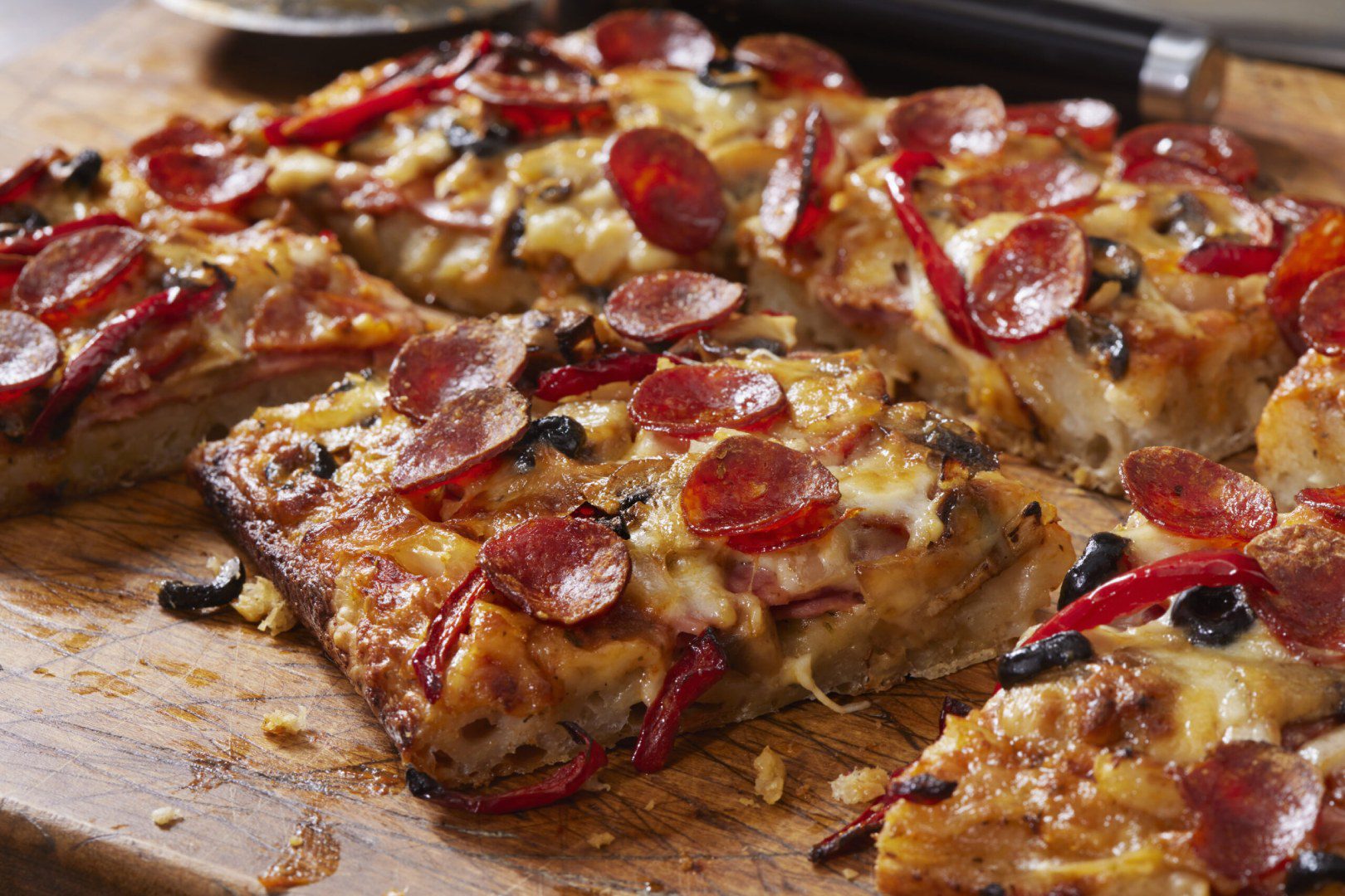 A close up of some pizza on a pan